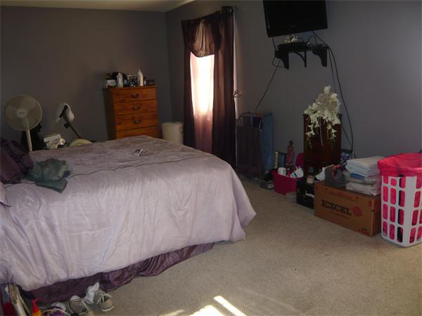 23 Ambrose Street Springfield, MA 01109 - Photo 10 of 15 a bedroom with a bed and a lamp on dresser
