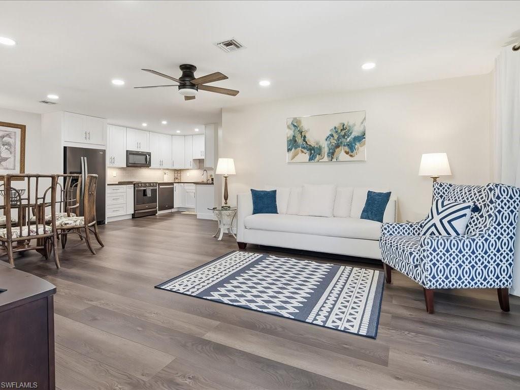 186 Harrison Road, Unit H2 Naples, FL 34112 - Photo 15 of 38 a living room with furniture and wooden floor