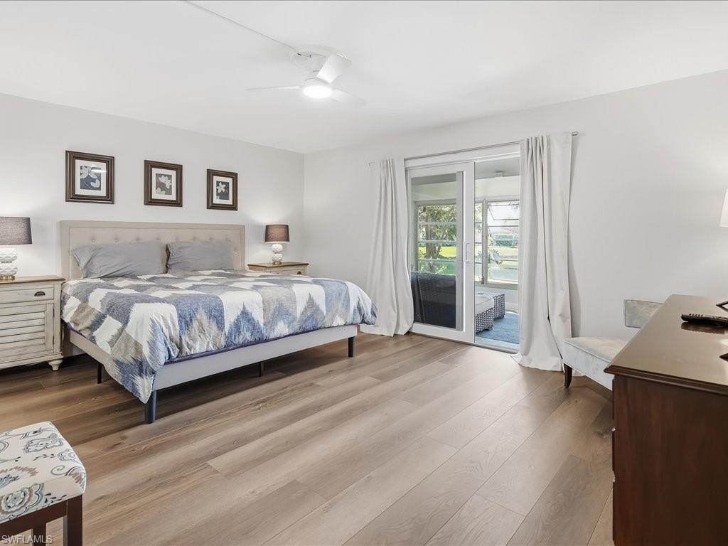 186 Harrison Road, Unit H2 Naples, FL 34112 - Photo 26 of 38 a bedroom with a bed and a desk