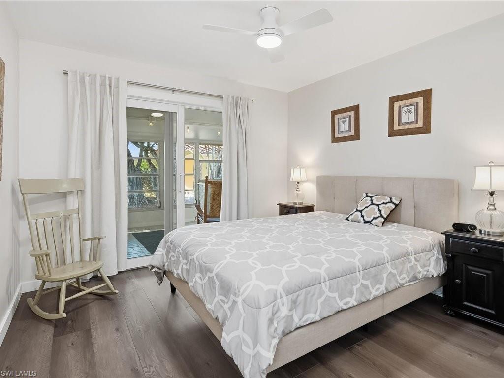 186 Harrison Road, Unit H2 Naples, FL 34112 - Photo 31 of 38 a bedroom with a bed and painting on the wall