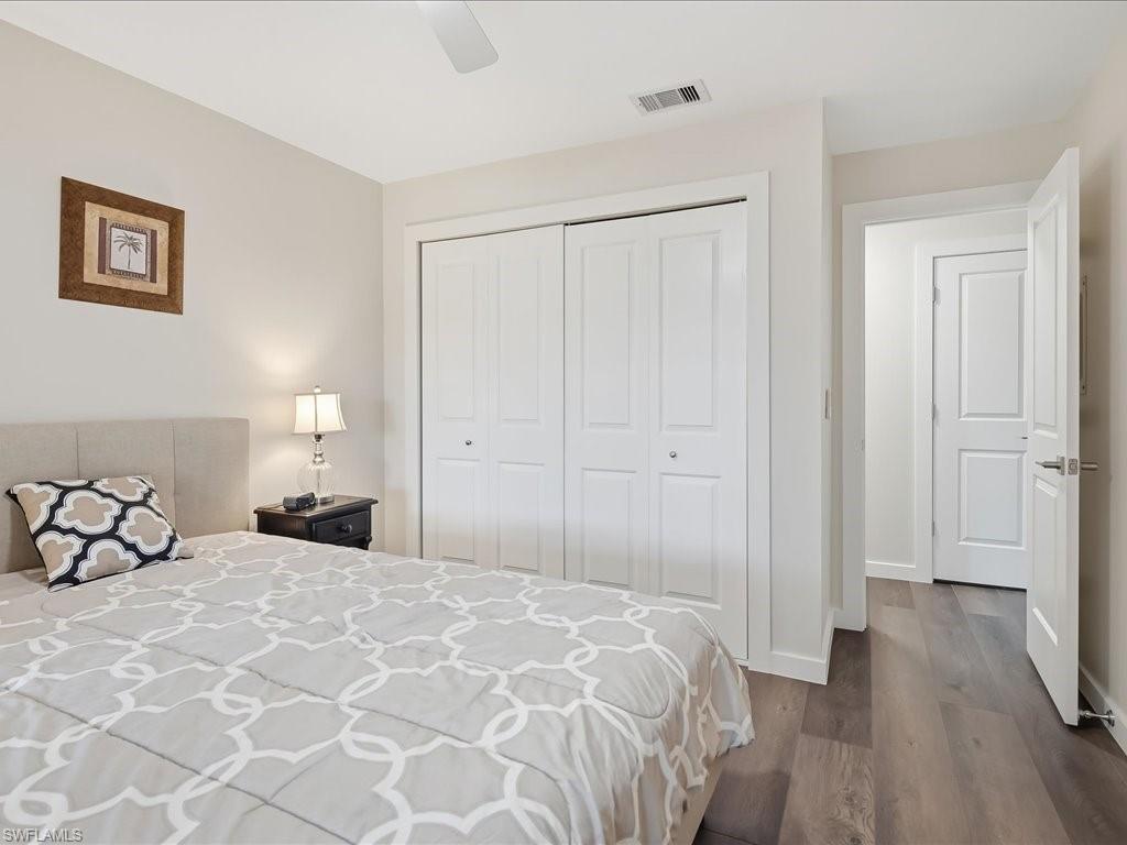 186 Harrison Road, Unit H2 Naples, FL 34112 - Photo 32 of 38 a bedroom with a bed and a window