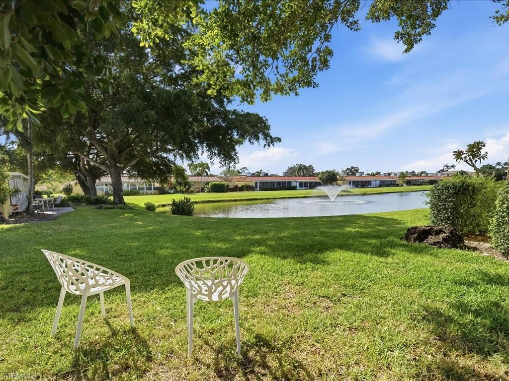 186 Harrison Road, Unit H2 Naples, FL 34112 - Photo 6 of 38 View of grassy yard featuring a water view