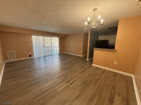 a view of a livingroom with wooden floor