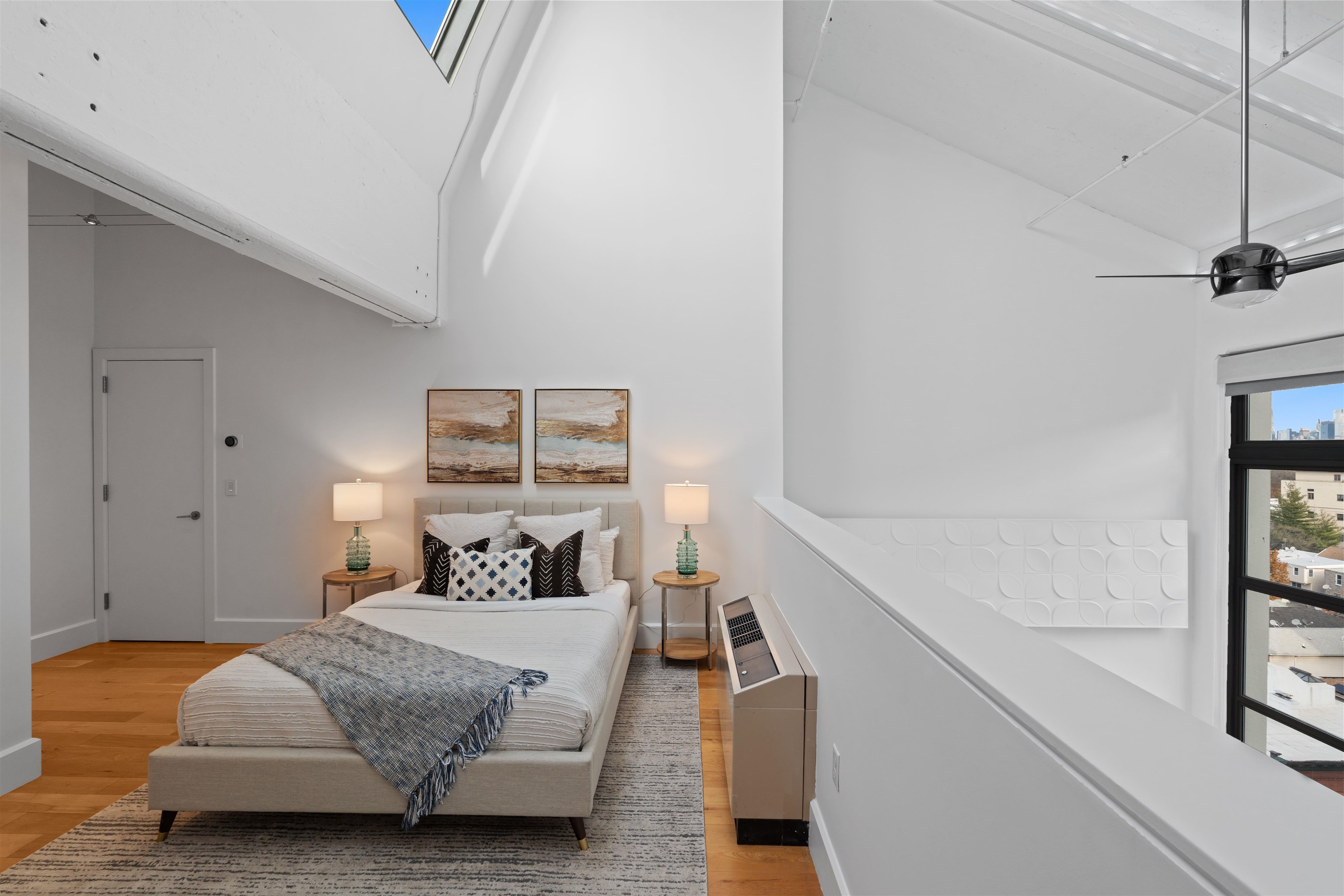 50 Dey Street, Unit 663 Jersey City, NJ 07306 - Photo 25 of 37 a bedroom with furniture and a window