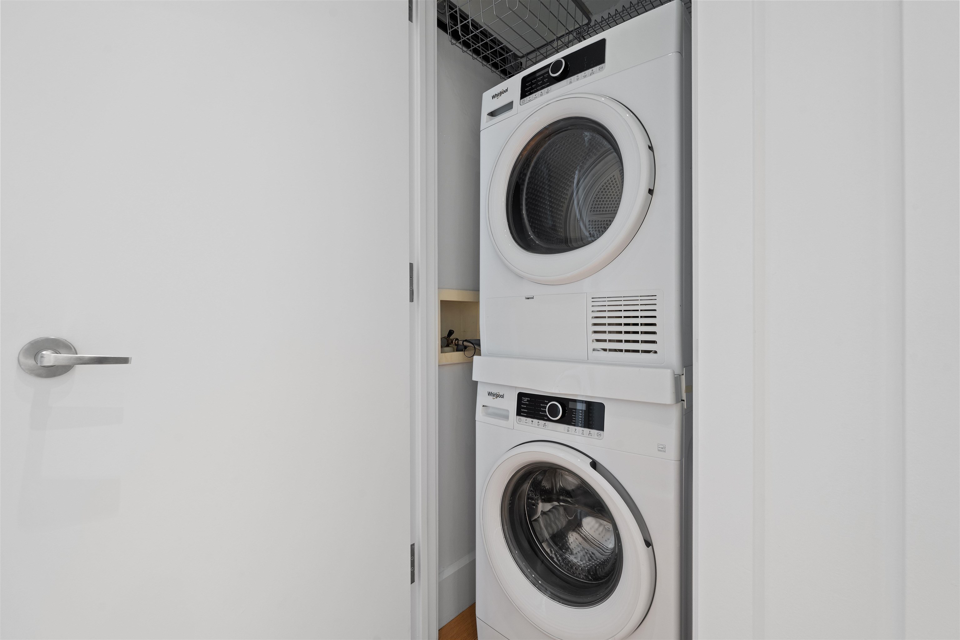 50 Dey Street, Unit 663 Jersey City, NJ 07306 - Photo 30 of 37 a view of a hallway with washer and dryer