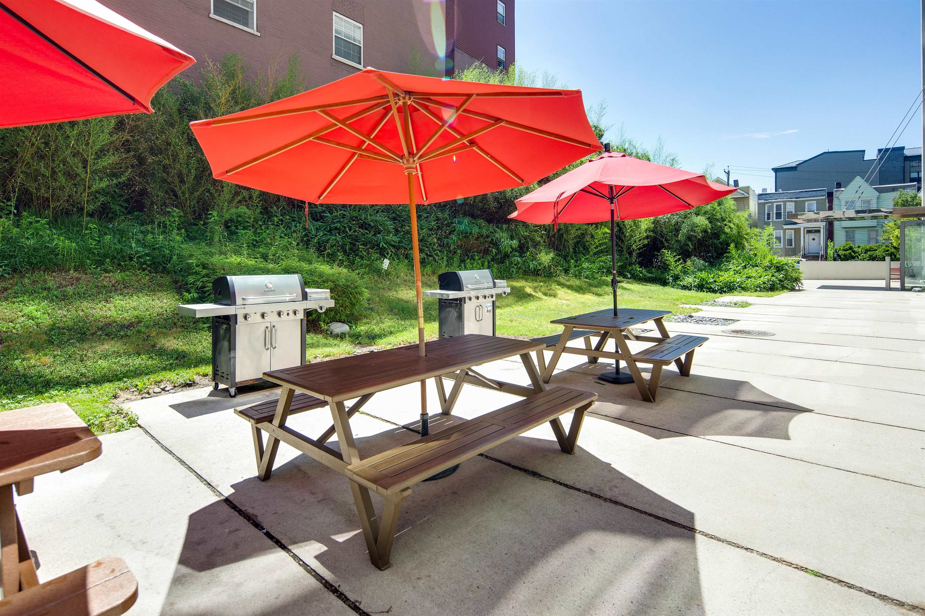 50 Dey Street, Unit 663 Jersey City, NJ 07306 - Photo 33 of 37 an outdoor space with furniture and umbrella