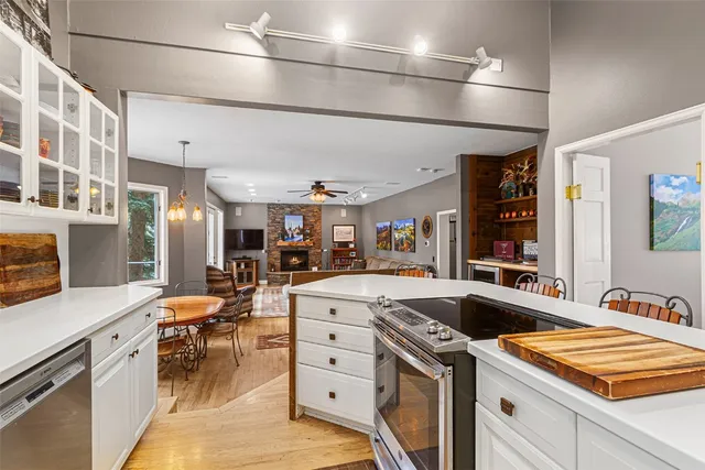 a kitchen that has a lot of cabinets in it