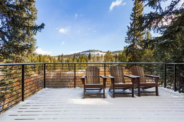 a view of deck with chairs and wooden floor