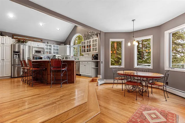 a view of a dining room with furniture window and wooden floor