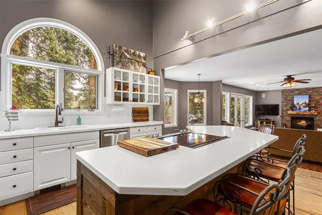 a kitchen with a dining table and chairs