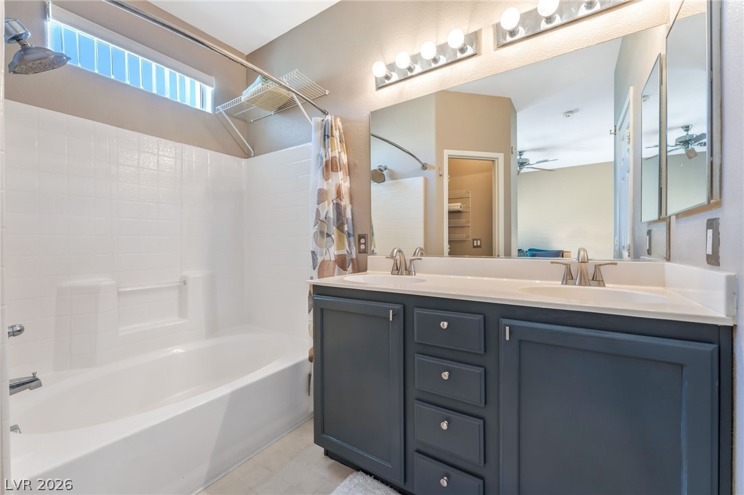6317 Snap Ridge Street, Unit 101 North Las Vegas, NV 89081 - Photo 16 of 40 Primary bathroom has a dual vanity, tub/shower with a garden tub, private water closet and walk in closet.