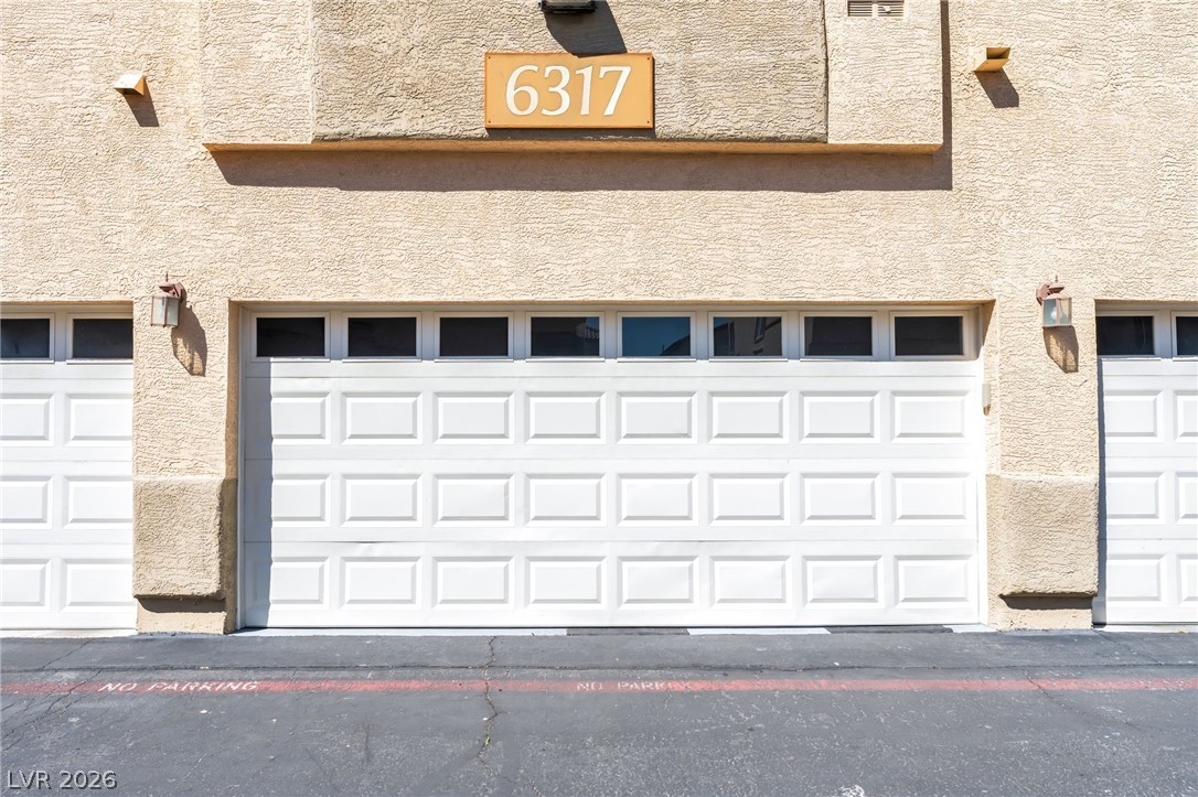 6317 Snap Ridge Street, Unit 101 North Las Vegas, NV 89081 - Photo 28 of 40 Garage exterior.