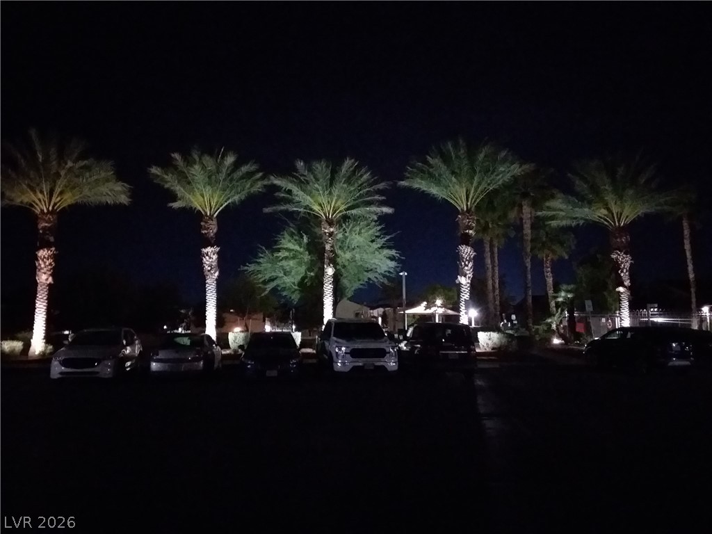 6317 Snap Ridge Street, Unit 101 North Las Vegas, NV 89081 - Photo 32 of 40 Community lit up at night.