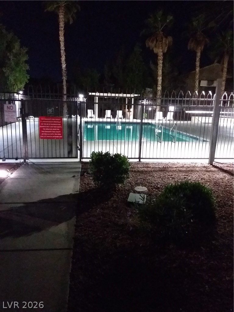 6317 Snap Ridge Street, Unit 101 North Las Vegas, NV 89081 - Photo 33 of 40 Community lit up at night.