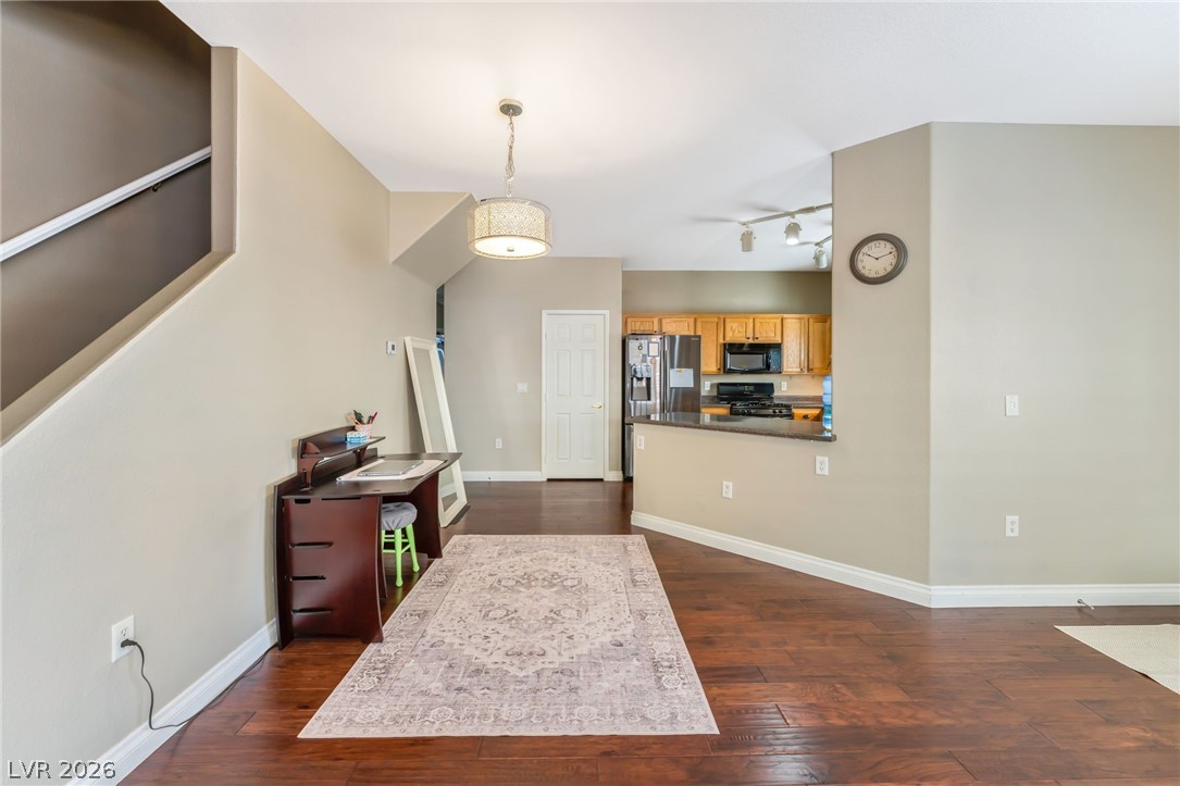 6317 Snap Ridge Street, Unit 101 North Las Vegas, NV 89081 - Photo 5 of 40 The dining area sits between the spacious living room and kitchen.
