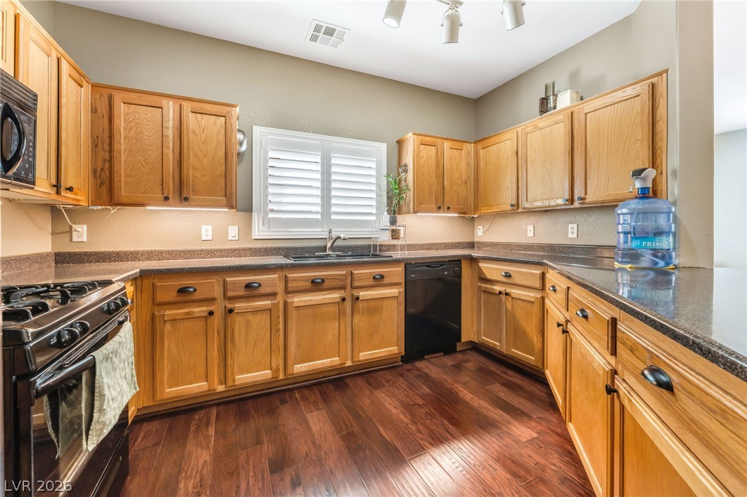 6317 Snap Ridge Street, Unit 101 North Las Vegas, NV 89081 - Photo 7 of 40 Tons of storage and counter space in this kitchen.