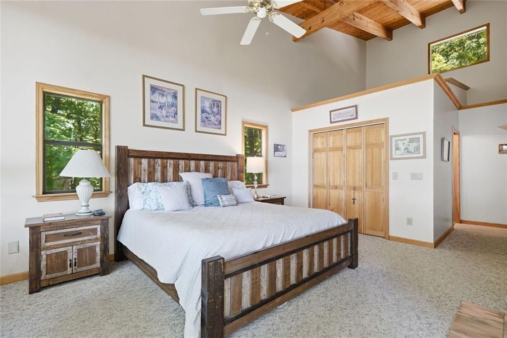 251 Panorama Point Jasper, GA 30143 - Photo 15 of 93 a bedroom with a bed a mirror and a window