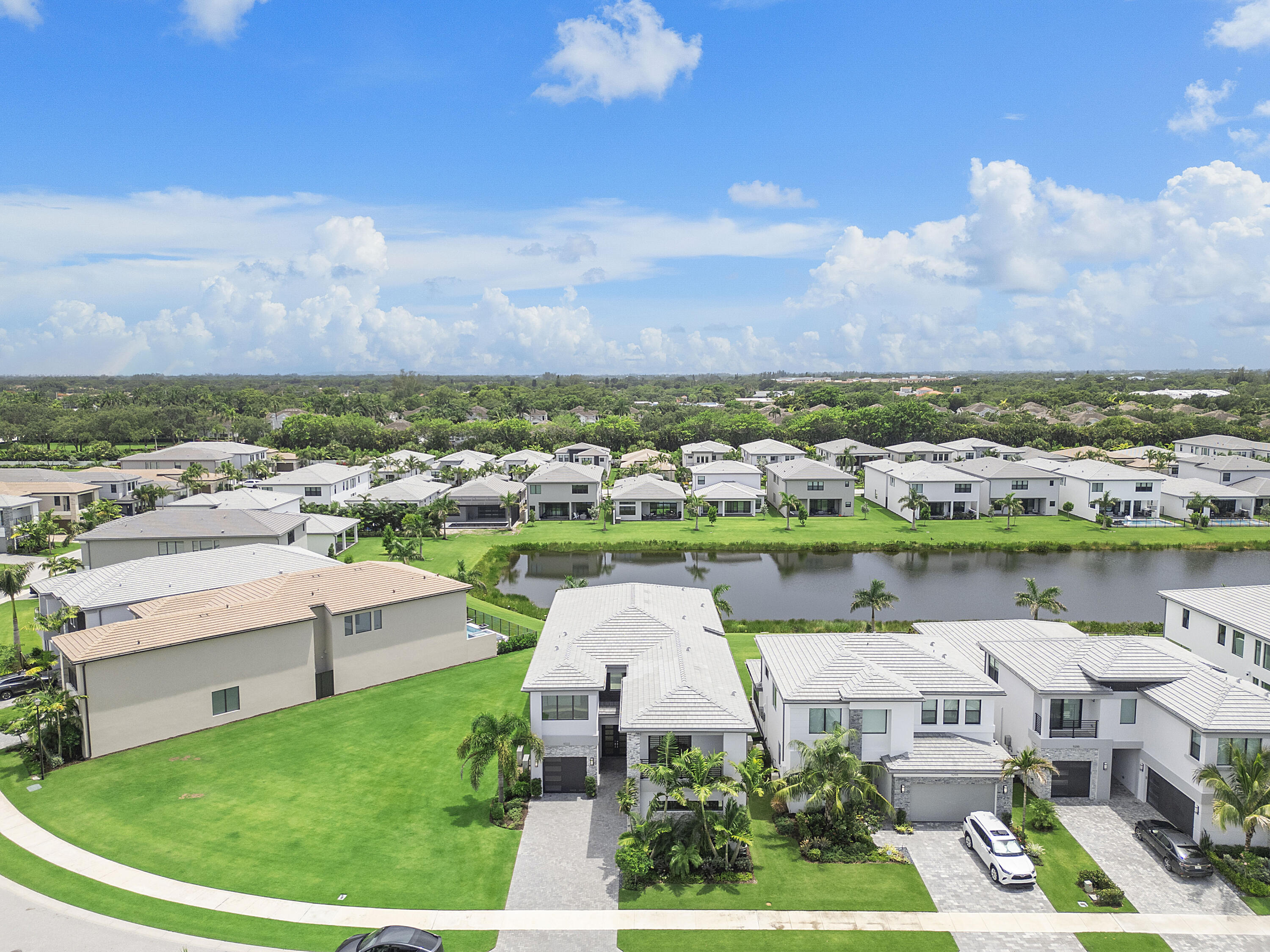 9322 Sunflower Mdw Road Boca Raton, FL 33434 - Photo 66 of 87 an aerial view of a house with a garden and lake view