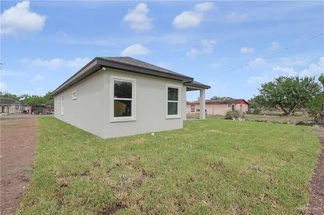 a house view with a garden space