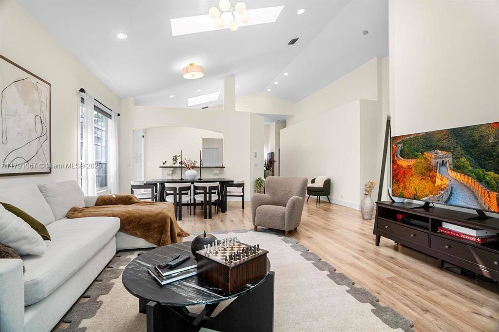 6375 Northwest 24th Street Boca Raton, FL 33434 - Photo 4 of 13 a living room with furniture and a flat screen tv