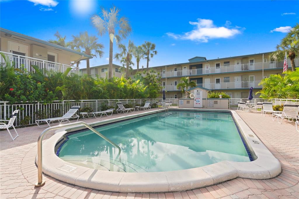 5800 Margate Boulevard, Unit 3463 Margate, FL 33063 - Photo 1 of 37 a view of a swimming pool with a lounge chairs