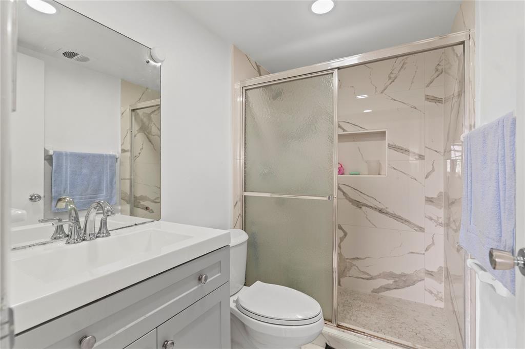 5800 Margate Boulevard, Unit 3463 Margate, FL 33063 - Photo 13 of 37 a bathroom with a sink toilet and shower
