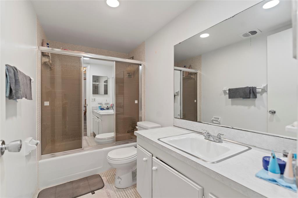 5800 Margate Boulevard, Unit 3463 Margate, FL 33063 - Photo 16 of 37 a bathroom with a sink toilet vanity and shower