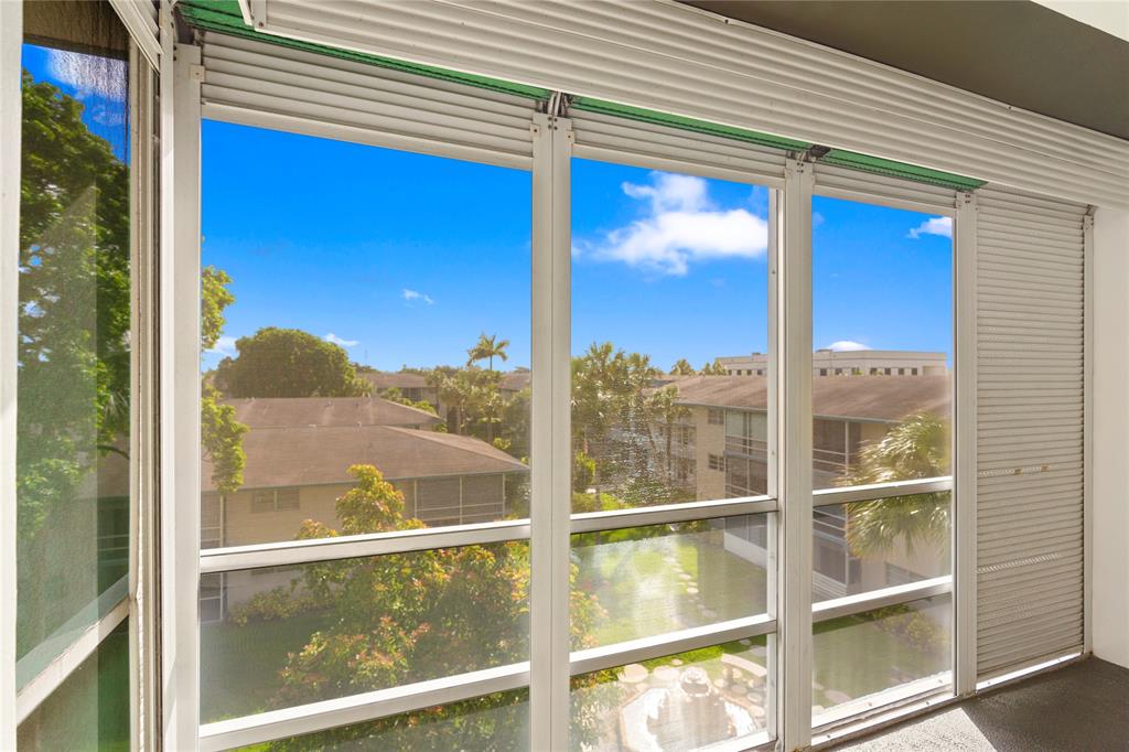5800 Margate Boulevard, Unit 3463 Margate, FL 33063 - Photo 20 of 37 a view of a balcony from a window