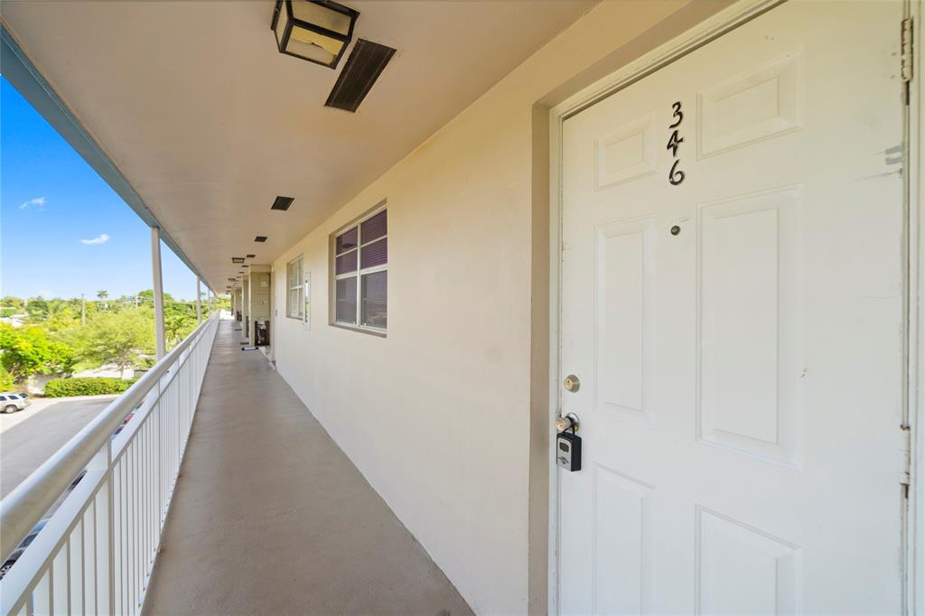 5800 Margate Boulevard, Unit 3463 Margate, FL 33063 - Photo 21 of 37 a view of a hallway with wooden floor and staircase