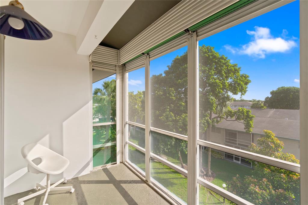 5800 Margate Boulevard, Unit 3463 Margate, FL 33063 - Photo 22 of 37 a view of balcony with a potted plant