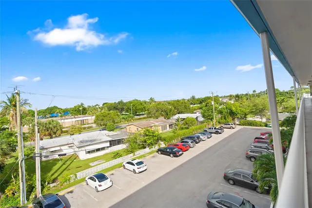 a view of a hallway with windows