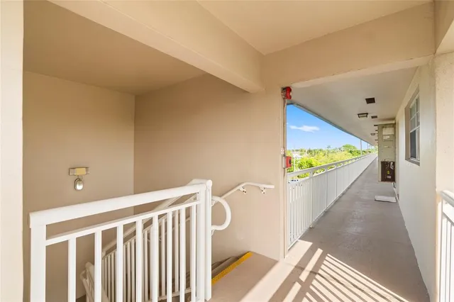 a view of a hallway with a large window