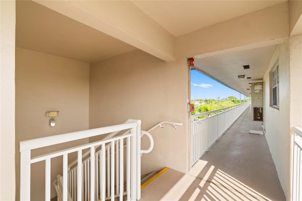 5800 Margate Boulevard, Unit 3463 Margate, FL 33063 - Photo 26 of 37 a view of a hallway with windows