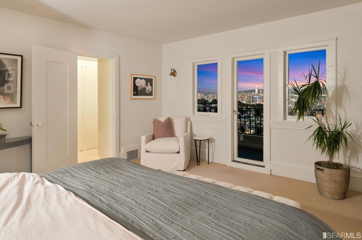 58 Graystone Terrace San Francisco, CA 94114 - Photo 39 of 88 a bedroom with furniture and a potted plant