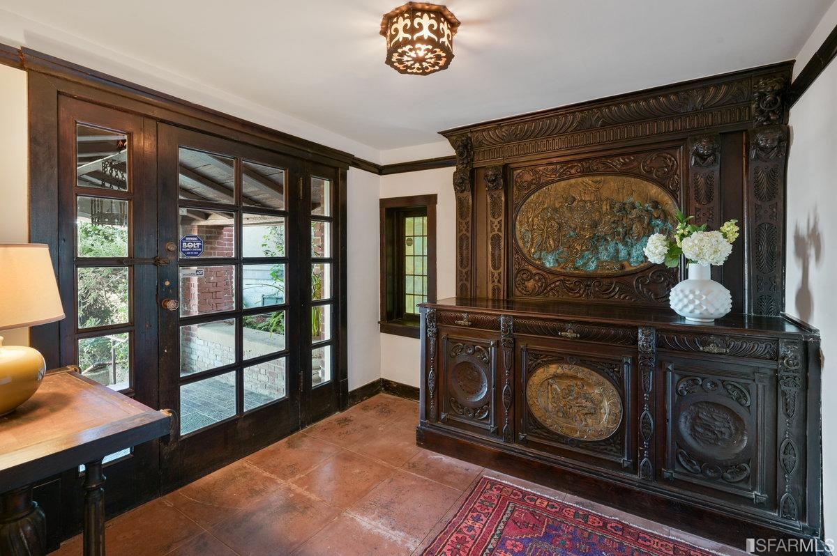 58 Graystone Terrace San Francisco, CA 94114 - Photo 6 of 88 a utility room with wooden floor and a fireplace