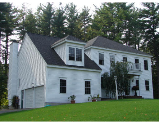 139 Gates Pond Road Berlin, MA 01503 - Photo 2 of 12 a front view of house with yard and green space