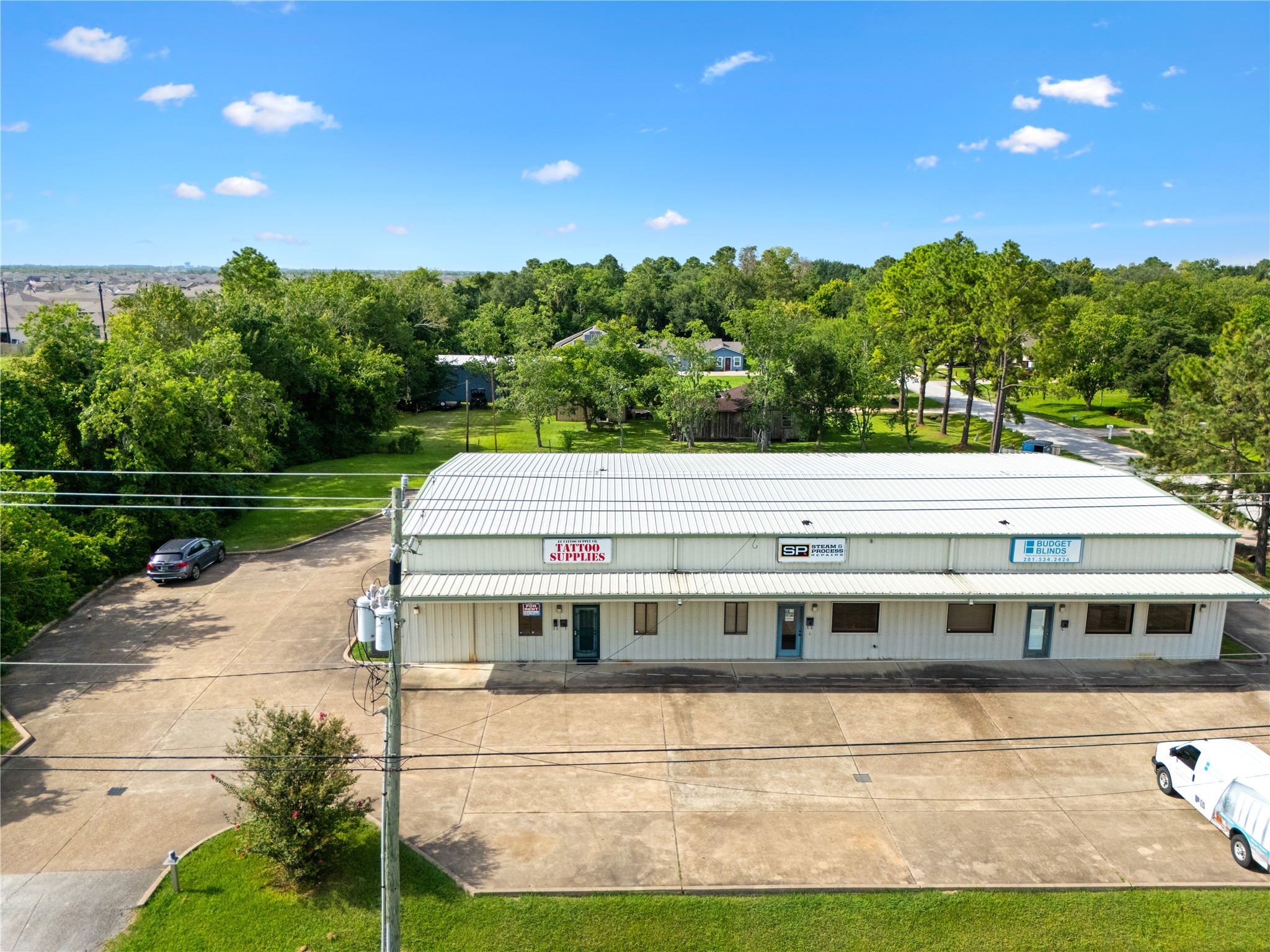 a front view of a house with a garden and yard