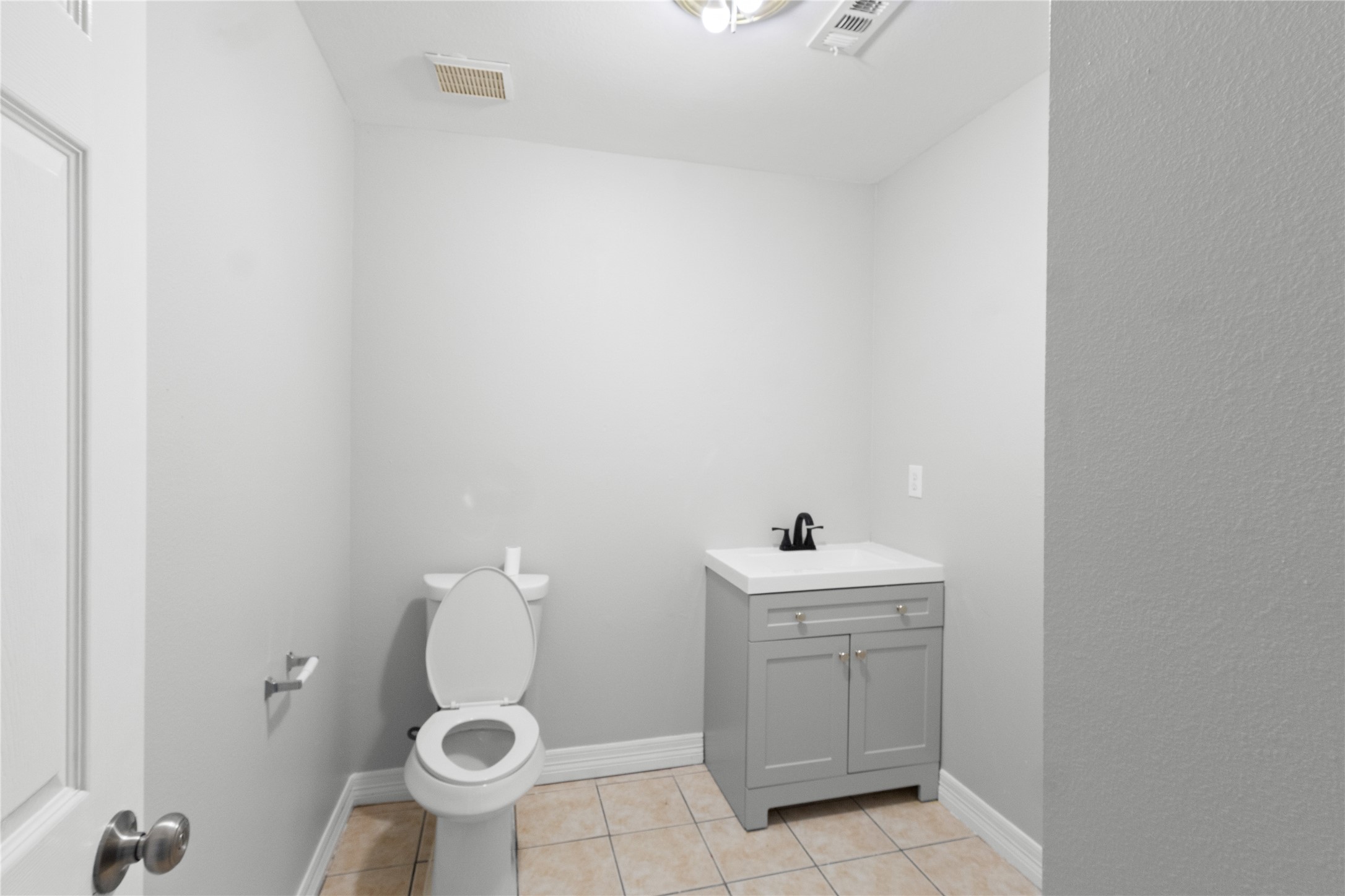 8019 West Fm 517 Road West Dickinson, TX 77539 - Photo 11 of 16 a bathroom with a sink toilet and a mirror