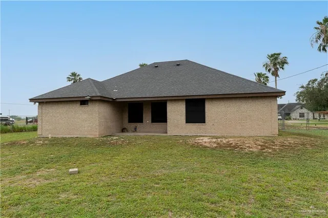 a house that has garden in front of it