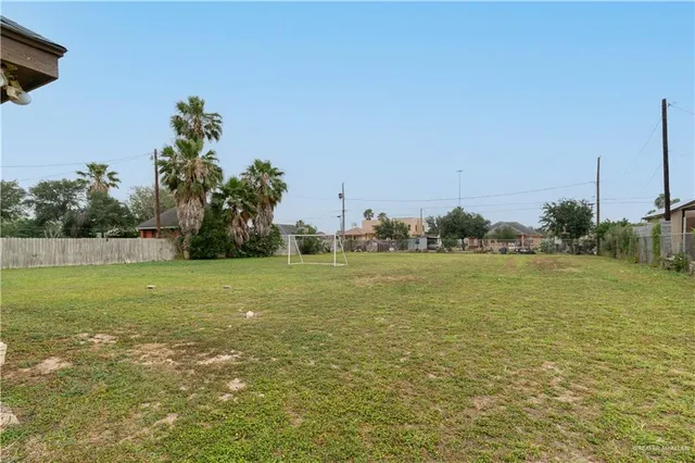 a view of a field with an ocean