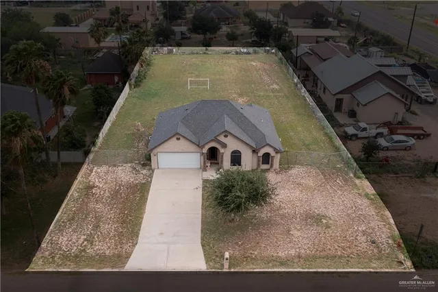 an aerial view of a house with swimming pool