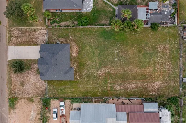 an aerial view of residential house with outdoor space