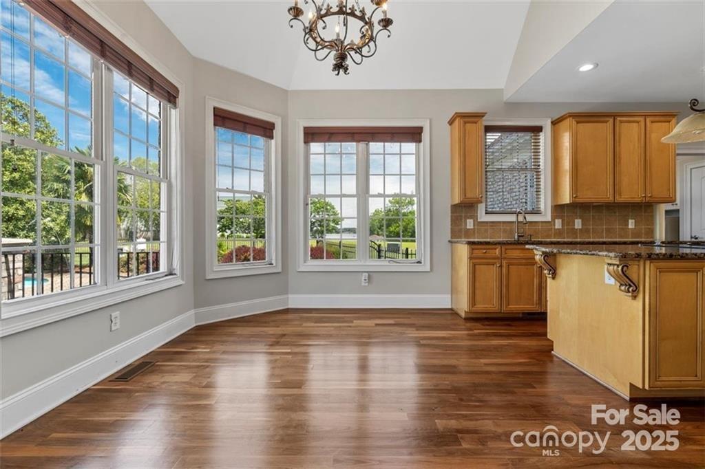 1765 Old Clay Hill Road York, SC 29745 - Photo 18 of 47 a view of a kitchen with wooden floor and a window