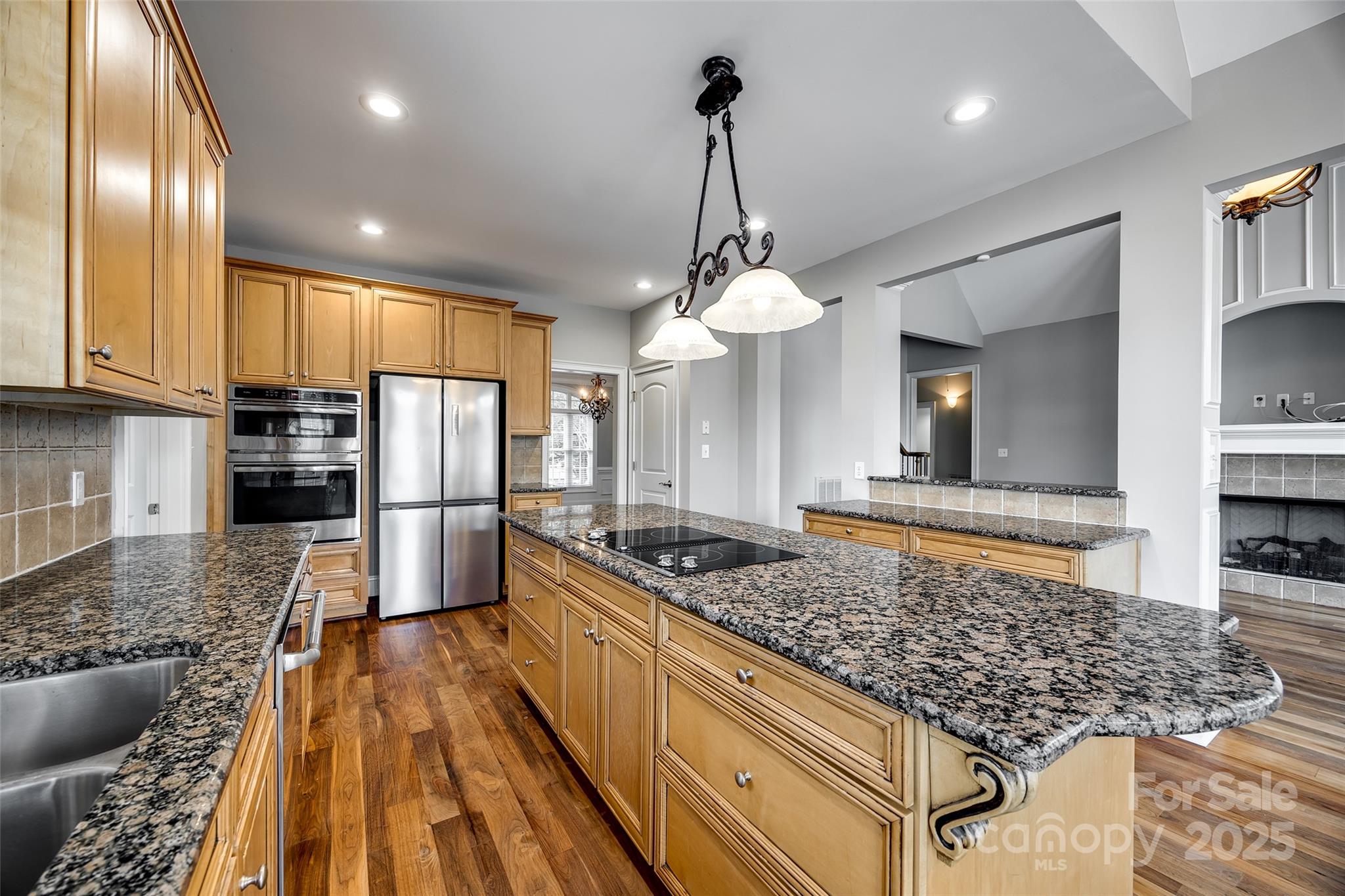 1765 Old Clay Hill Road York, SC 29745 - Photo 22 of 47 a kitchen with stainless steel appliances granite countertop a sink a stove and refrigerator