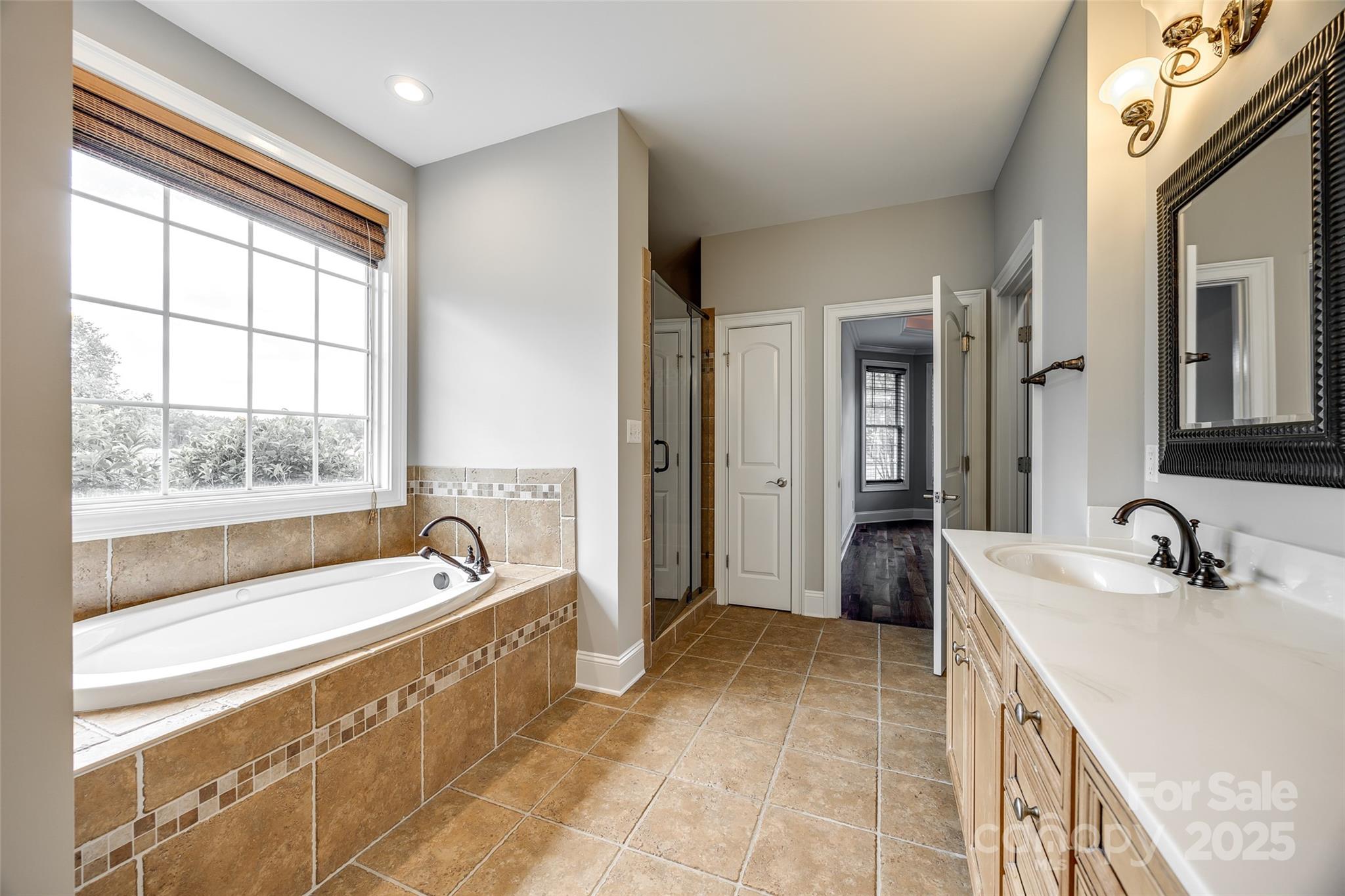 1765 Old Clay Hill Road York, SC 29745 - Photo 28 of 47 a spacious bathroom with a tub sink and mirror