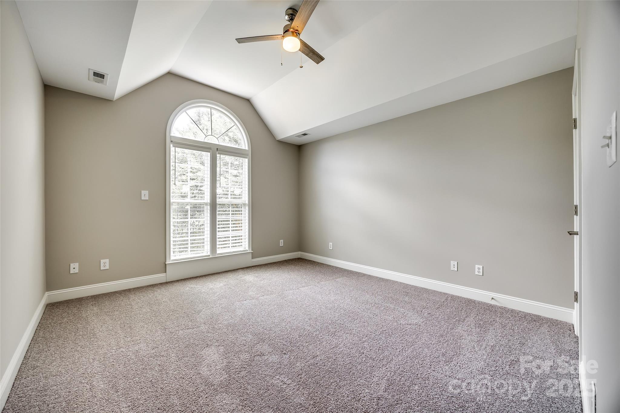 1765 Old Clay Hill Road York, SC 29745 - Photo 30 of 47 an empty room with windows and ceiling fan