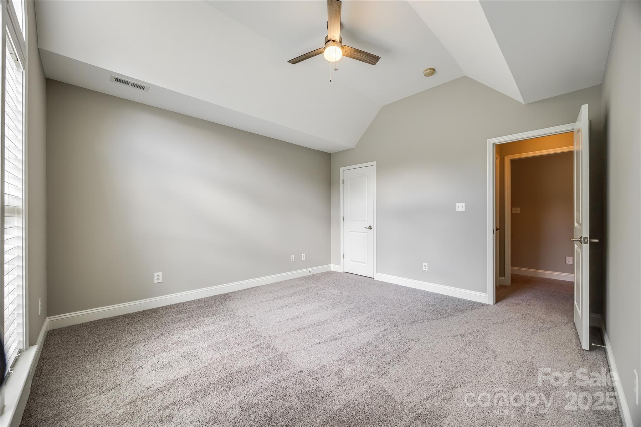 1765 Old Clay Hill Road York, SC 29745 - Photo 31 of 47 an empty room with a ceiling fan and a window