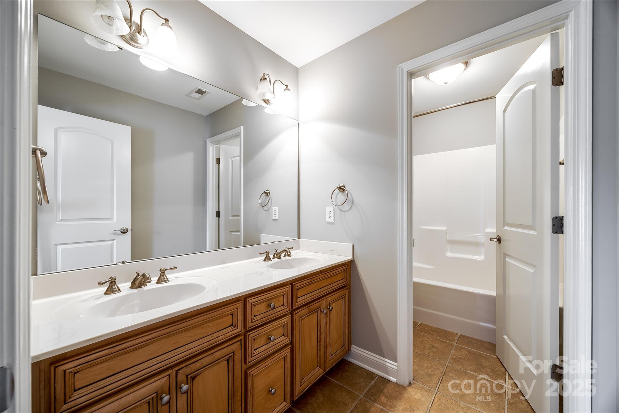 1765 Old Clay Hill Road York, SC 29745 - Photo 36 of 47 a spacious bathroom with a double vanity sink mirror and double