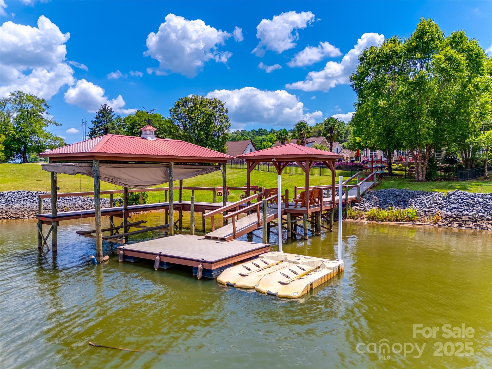 1765 Old Clay Hill Road York, SC 29745 - Photo 42 of 47 a view of a swimming pool with a table and chairs under an umbrella