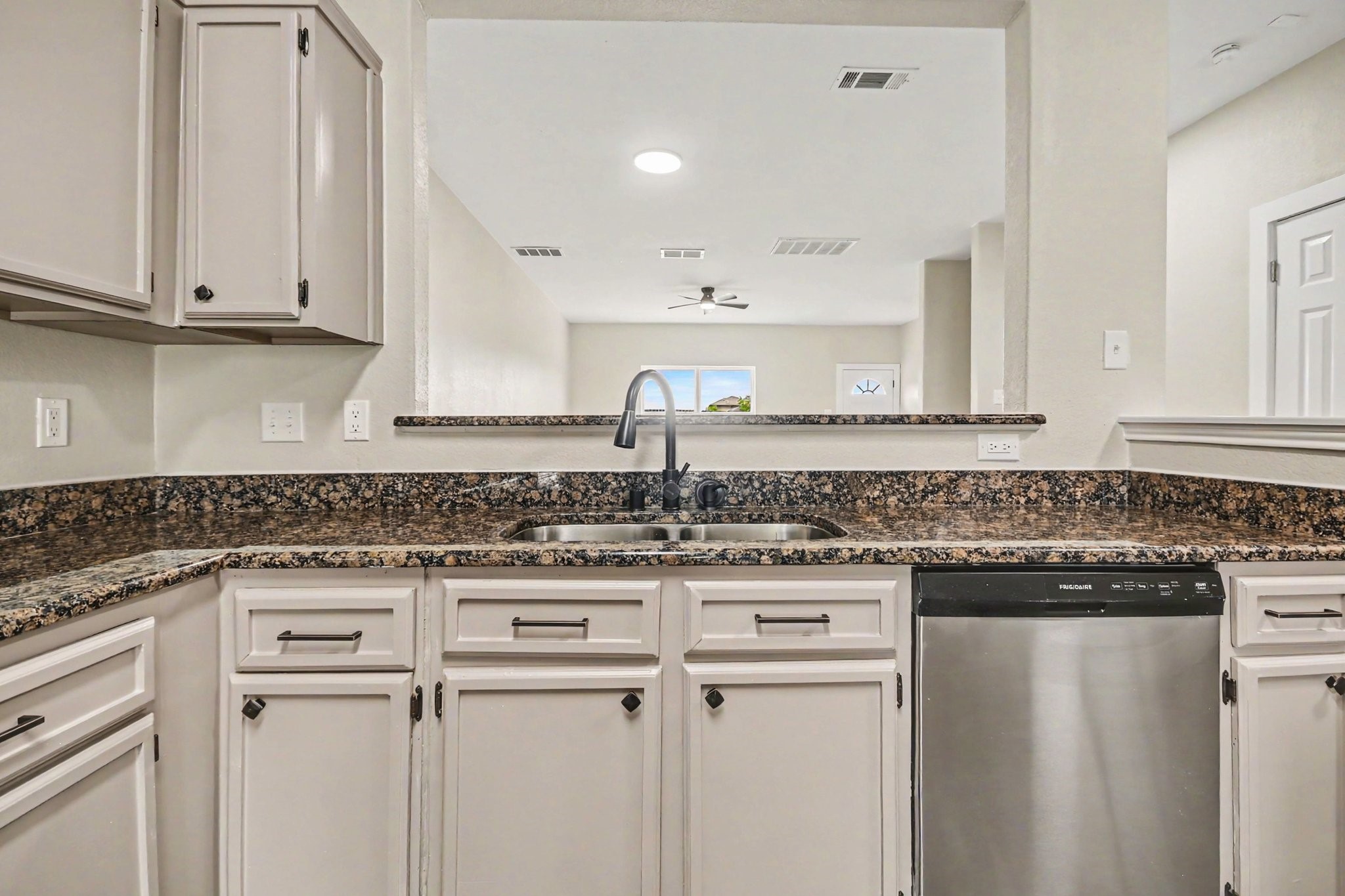 1322 Diamond Drape Drive Rosharon, TX 77583 - Photo 15 of 45 a kitchen with cabinets appliances a sink and a counter top space